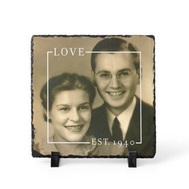 Sepia toned photo of young couple from 1940 on slate plaque