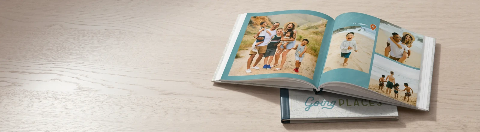 Open photo book with beach family photos; text reads 'Turn summer memories into a photo book.