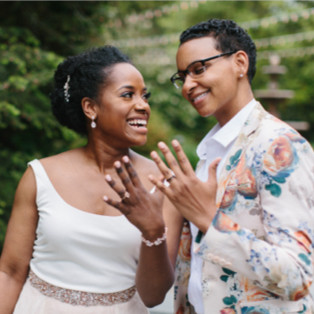 Couple showing off their rings