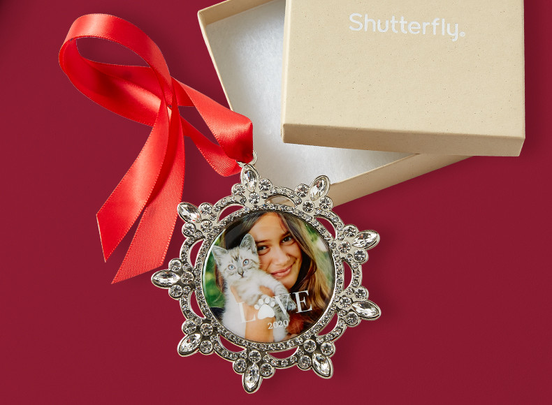 A custom photo Christmas ornament in a Shutterfly gift box