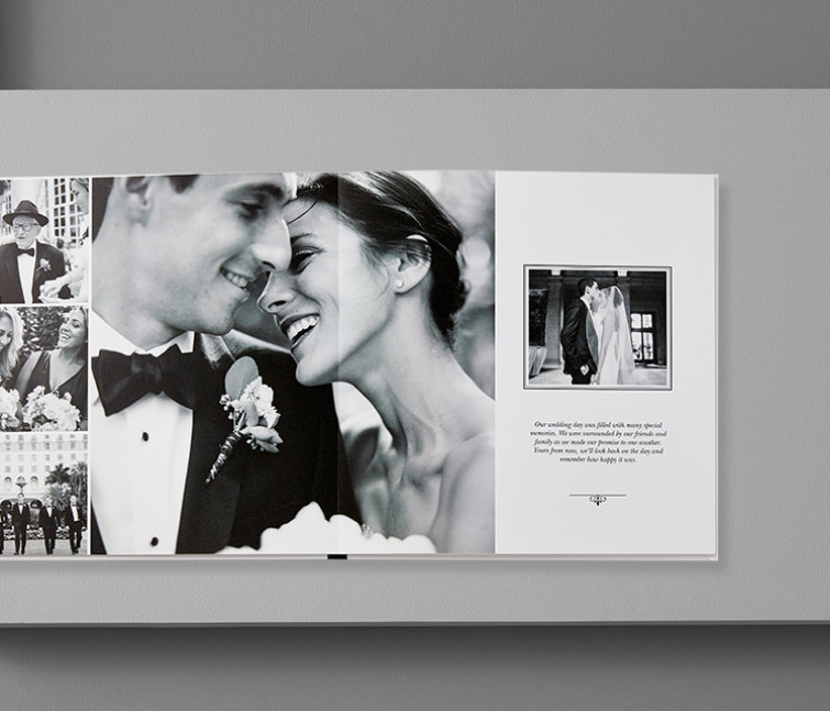 A custom leather wedding photo book with pictures of a bride and groom